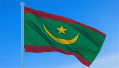 The flag of Mauritania, Mauritania, flutters in the wind, isolated against a blue sky, Africa