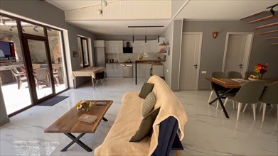 Interior of a modern house, living room and kitchen. Nobody inside