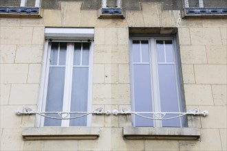 Window railings and balconies on residential buildings designed by Hector Guimard in the Art
