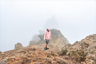 A tourist visiting the very cloudy Pico de las Nieves in Gran Canaria, Canary Islands. Spain