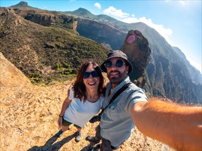 Selfie of a couple at the Roque Palmes viewpoint near Roque Nublo in Gran Canaria, Canary Islands
