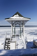 Winter, small gazebo with view over frozen river, Province of Quebec, Canada, North America