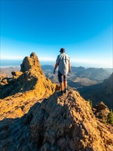 A tourist man at the top of Pico de las Nieves in Gran Canaria, Canary Islands