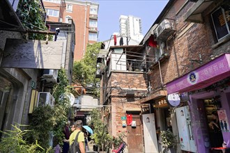 Stroll through the restored Tianzifang neighbourhood, A narrow alley with traditional buildings and