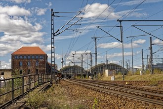 In the foreground, the railway tracks and Postbahnhof Berlin building and the Ostbahnhof station