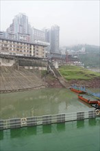 Yichang, Hubei Province, China, Asia, A cloudy day with a view of a river, multi-storey buildings