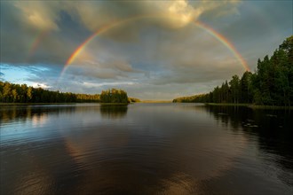 Double rainbow over lake near Hartola, forest, evening mood, Finland, Europe