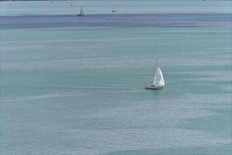 Sailing boat on the turquoise waters of Lake Constance, near Meersburg, Baden-Wuerttemberg,