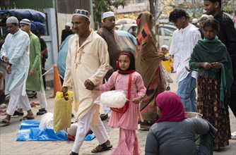 GUWAHATI, INDIA, APRIL 11: Muslim people with children walk towards an Eidgah to perform Eid