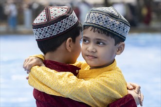 Muslim children celebrate Eid al-Fitr, which marks the end of the fasting month of Ramadan, after