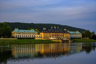 View of Pillnitz Palace from the Elbe in the glow of the setting evening sun, Dresden, Saxony,