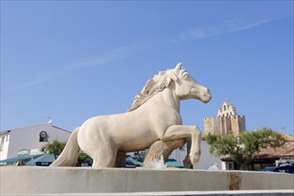 Statue of a Camargue horse in a fountain, Les Saintes-Maries-de-la-Mer, Camargue, Bouches-du-Rhone,