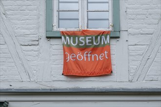 Banner with inscription Museum open at the Natureum im palace gardens, Ludwigslust,
