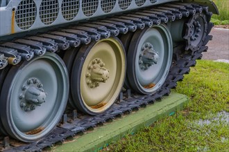 Closeup of wheels and track of military tank on display in public park in Nonsan, South Korea, Asia