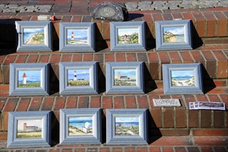 Westerland, Sylt, Schleswig-Holstein, Germany, Europe, Several framed paintings of lighthouses and