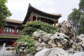China, Beijing, Forbidden City, UNESCO World Heritage Site, An ornate Chinese pavilion peeking out