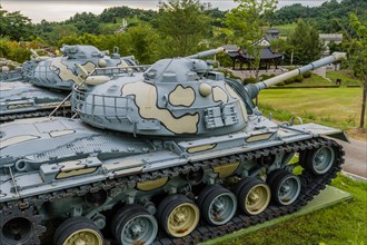 Military tanks with camouflage paint on display in public park in Nonsan, South Korea, Asia
