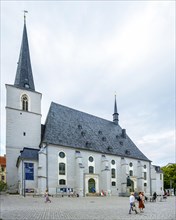 Everyday scene in front of the Herderkirche, actually the town church of St Peter and Paul, a