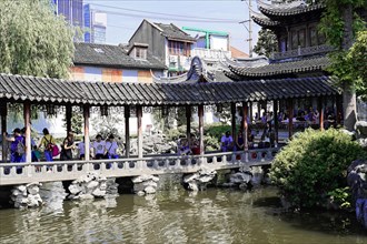 Excursion to Zhujiajiao Water Village, Shanghai, China, Asia, Tourists walk across a covered bridge