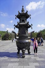 Chongqing, Chongqing Province, China, Asia, Large traditional Chinese incense burner on a square
