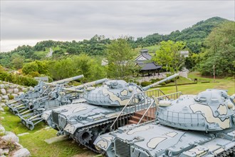 Closeup of military tanks with camouflage paint on display in public park in Nonsan, South Korea on