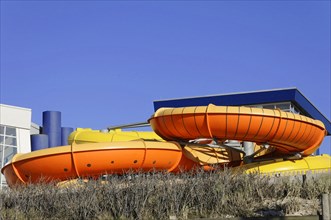 Westerland, Sylt, Schleswig-Holstein, Germany, Europe, Large orange-yellow outdoor water slides in