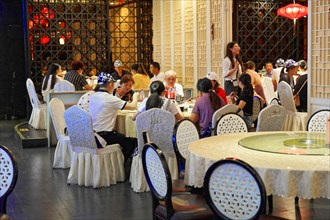 Dinner at posh restaurant in Shanghai, China, Asia, People enjoying a meal on a restaurant terrace
