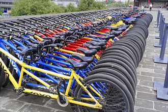 Rental bicycles, Xian, Shaanxi, China, Asia, Ordered rows of bicycles in different colours for