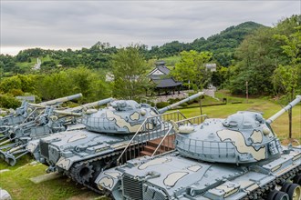 Closeup of military tanks with camouflage paint on display in public park in Nonsan, South Korea,
