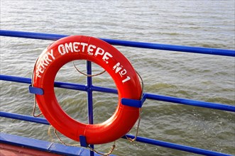 Lake Nicaragua, Ometepe Island in the background, Red lifebuoy on board a ferry with the lettering