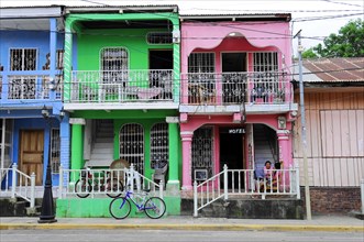 San Juan del Sur, Nicaragua, Colourful houses with a bicycle in the foreground in a tropical urban
