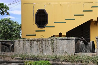 Granada, Nicaragua, The yellow facade of a building with baroque design elements and structures,