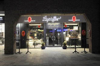 Evening, Westerland, Sylt, Schleswig-Holstein, Illuminated shop front of a bakery at night, Sylt,