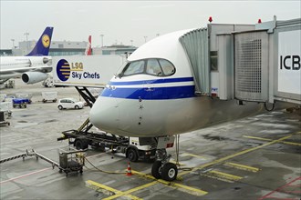 Flight CA 936 Frankfurt, Shanghai China, front view of a parked aircraft with catering vehicle at