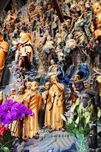 Jade Buddha Temple, Shanghai, Colourful relief of Asian figures in traditional dress, Shanghai,