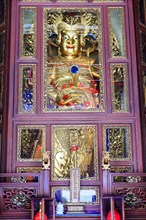 Jade Buddha Temple, Shanghai, A golden, decorated religious statue in a temple, Shanghai, China,