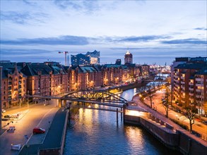 Aerial view of Speicherstadt Hamburg and the Elbe Philharmonic Hall with customs canal at blue