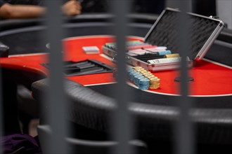 Close-up of poker chips on a casino table, the workplace at night, The Cologne police led a raid