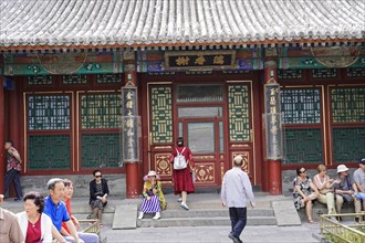 New Summer Palace, Beijing, China, Asia, People in front of a richly decorated traditional temple,