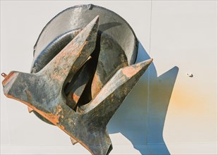 Closeup of ship metal anchor retracted into the hull of the ship in Yeosu, South Korea, Asia