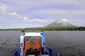 Lake Nicaragua, behind the island of Ometepe, view from the stern ferry onto a lake with a volcano