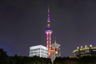 Oriental Pearl Tower, Pudong, Shanghai, China, Asia, The illuminated skyline at night with the
