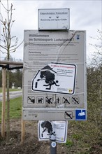 Sign at the entrance to Ludwigslust Castle Park with warning: Caution, danger to life due to fallen