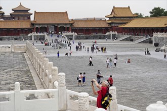 China, Beijing, Forbidden City, UNESCO World Heritage Site, view of visitors walking along the