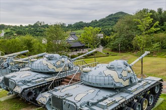 Closeup of military tanks with camouflage paint on display in public park in Nonsan, South Korea,