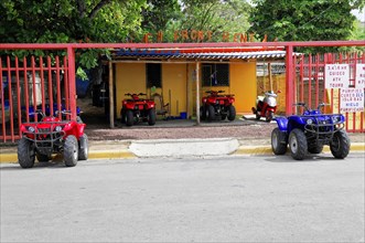 San Juan del Sur, Nicaragua, four-wheel drive vehicles for hire, parked in front of a colourful