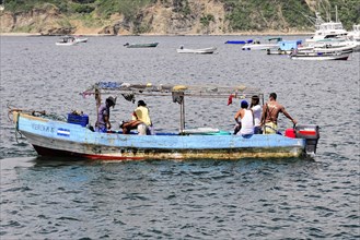 San Juan del Sur, Nicaragua, People on a fishing boat in the sea with swell, Central America,