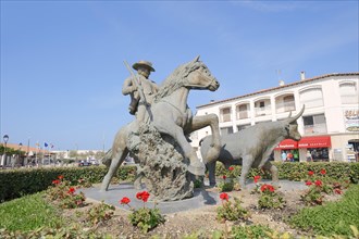 Statue of a drover with Camargue horse and Camargue bull, Les Saintes-Maries-de-la-Mer, Camargue,