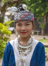 Portrait of a young Lao woman in traditional dress, Luang Prabang, Laos, Asia