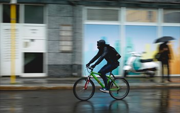 Cyclist in the rain, taken in Berlin, 19/04/2024